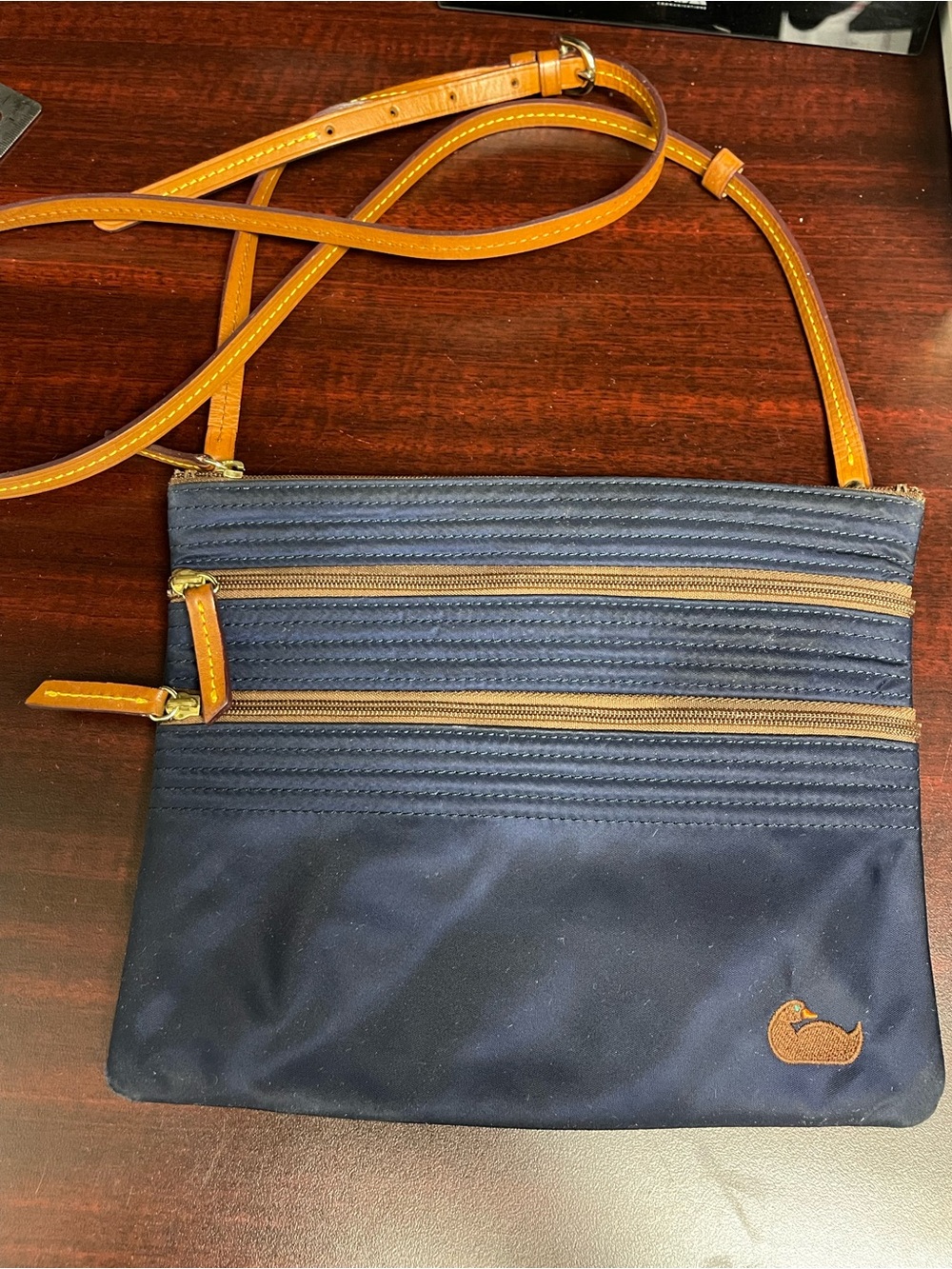 Dooney & Bourke Vintage Navy Crossbody Bag with Tan Strap